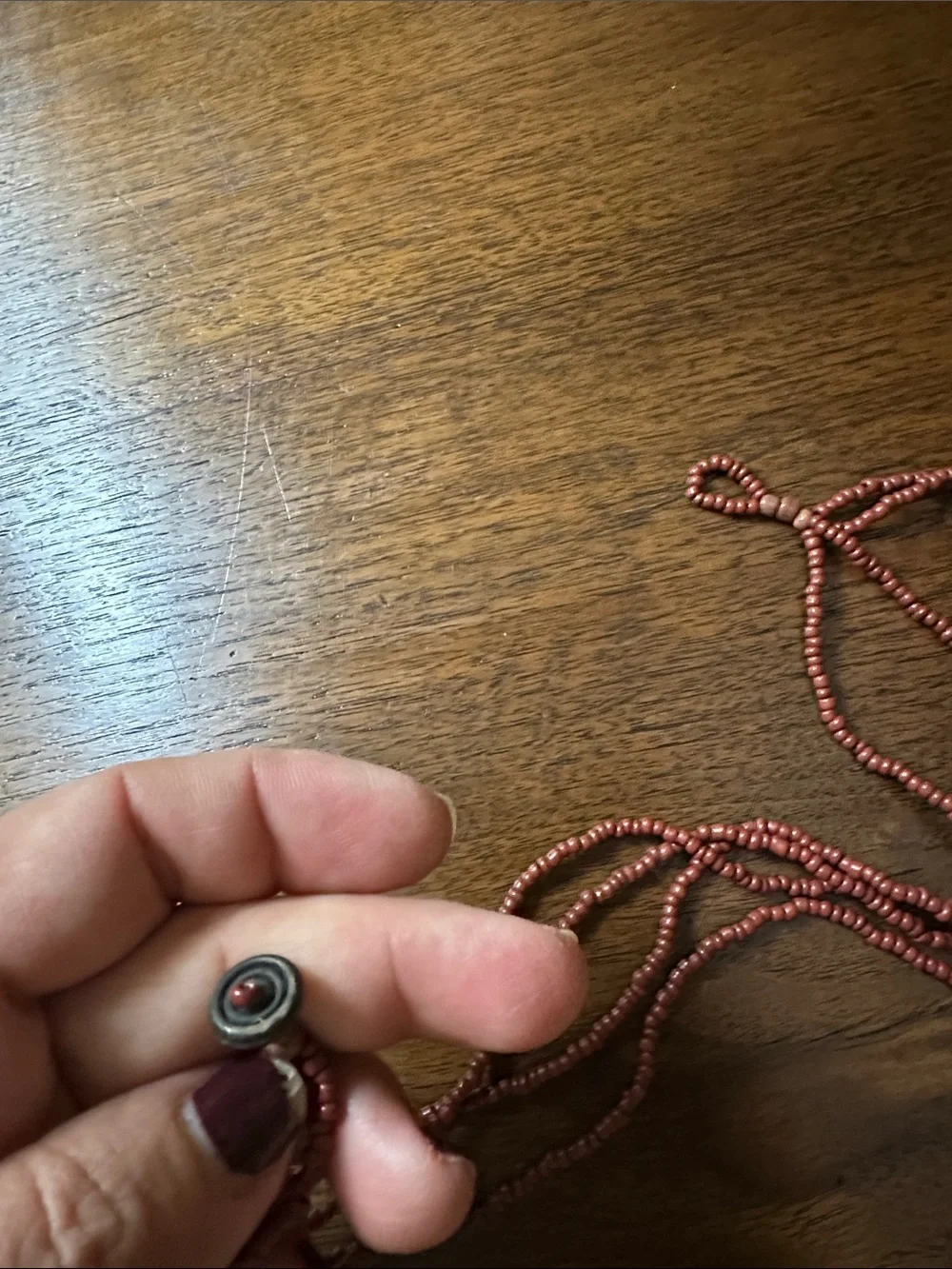 Multi-Strand Red Beaded Necklace with Iridescent Shell Pendant
